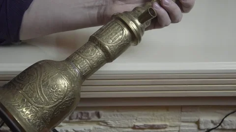 Man sees an old hookah Stock Footage 74195719