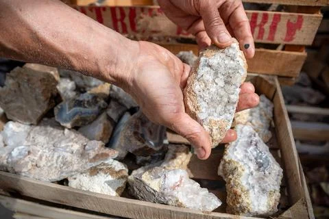 Man selecting agate to start working Stock Photos