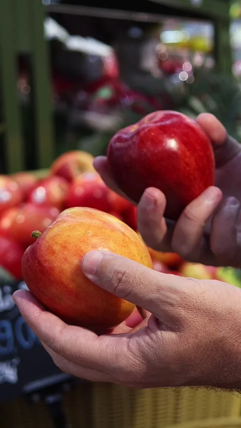 Man selecting fresh apples in supermarket Stock Footage 331470816