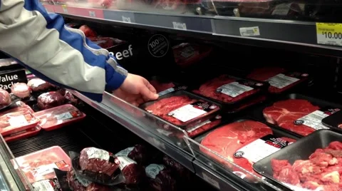 Man selecting raw beef in grocery store Stock Footage 48002788