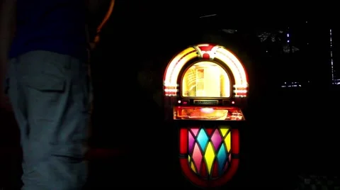 Man selects a song on a jukebox Video stock 40101556