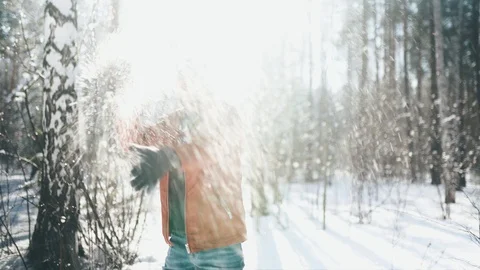 Man in self-isolation. Man play with snow in the forest. Relaxing aftter hard Stock Footage 128453729