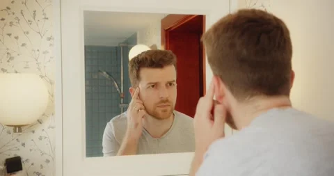 Man Selfcare Bathroom Mirror Checking Face Skin Health Morning Routine Video stock 195289803