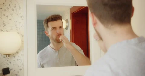 Man Selfcare Bathroom Mirror Checking Face Skin Health Morning Routine Video stock 195289852