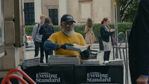 Man selling evening standard in central London Stock Footage 88955752