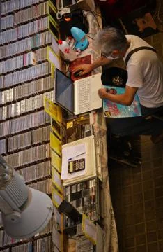 Man selling second-hand CDs at a record stall Stock Photos