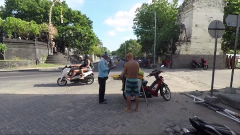 Man Sells Corn at Entrance, Split Gate, Kuta beach, Bali, Indonesia Stock Footage 303228202