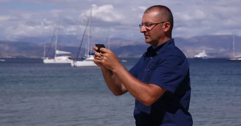 Man Send Sms Message Mobilephone Typing Peaceful Concept Coast Beach Destination Stock Footage 77012123