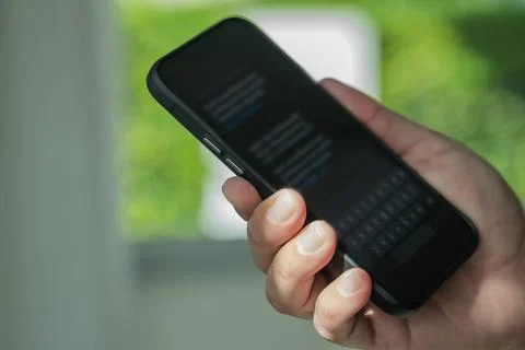 Man sending text message and sms with smartphone Communication Text Message.. Stock Photos