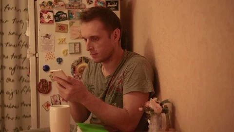 A man sends a message from his mobile Stock Footage 82186294