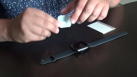 The man separates the substrate from the protective film. Before installing.. Stock Footage 279736977