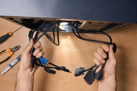 Man separating the wires of computer Stock Photos