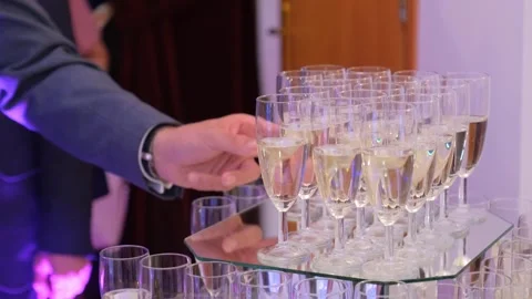 Man Serving Champagne Glasses at Indoor Nighttime Celebration Stock-Footage 342072679
