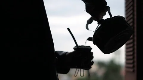 Man serving chimarrao - the typical drink of the gaucho people Stock Footage 79679597