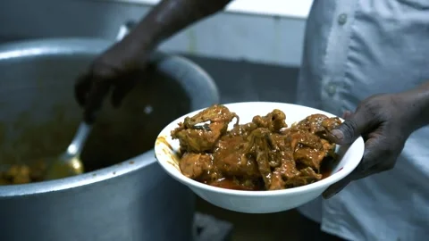A man serving delicious beef curry . Stock Footage 248158657