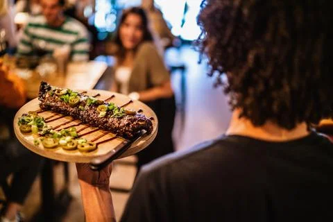 Man serving meat Stock Photos