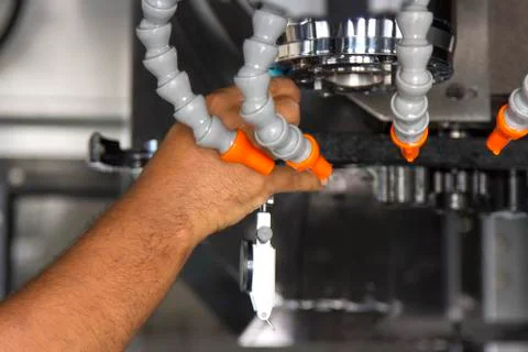 Man set up dial gauge for setting balance work   after cutting of CNC Stock Photos