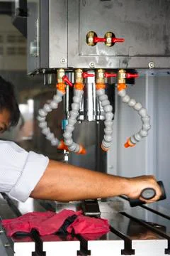 Man set up dial gauge for setting balance work   after cutting of CNC Stock Photos