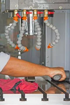 Man set up dial gauge for setting balance work   after cutting of CNC Stock Photos