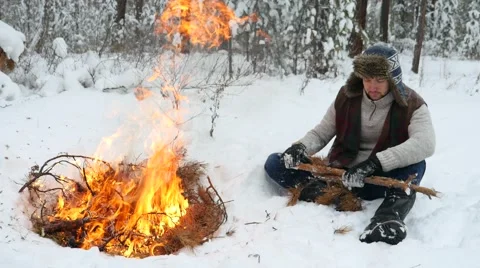 Man Set on Winter Campfire Stock Footage 59540509