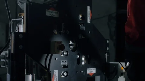 Man sets up automatic cable cutting machine. Complex for cable cutting. Stock Footage 105530640