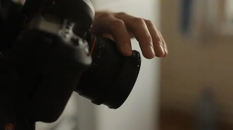 Man sets up camera Stock Footage 59134371