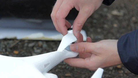 Man sets on drone propellers and tighten them. Stock Footage 69960229