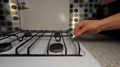 A man sets fire to gas. The camera shoots in high resolution. 4K Stock Footage 98972588