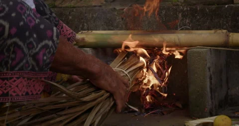 The man sets fire to grass Stock Footage 289643685