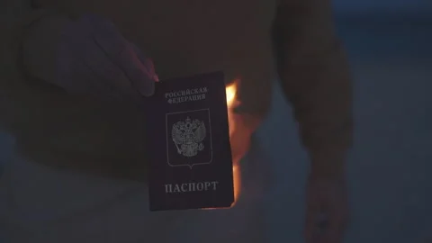 Man sets fire to his international passport as citizen of the Russian Federation Video stock 307212504