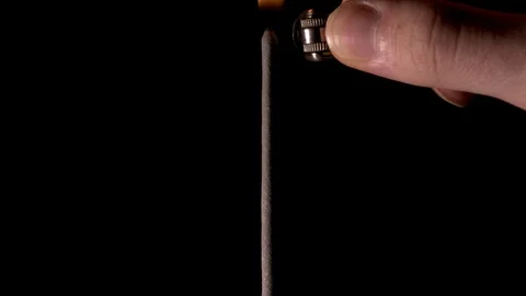 A man sets fire to pyrotechnics (sparkler). Stock Footage 117528361