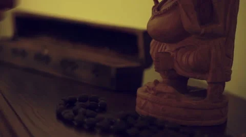 Man sets fire to a stick of incense and then lays out a yoga mat on the floor Stock Footage 67645425