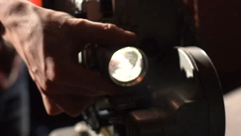 The man sets the focus on the projector Stock-Footage 86069573