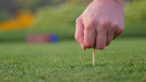 Man sets up his tee shot Stock Footage 60176611