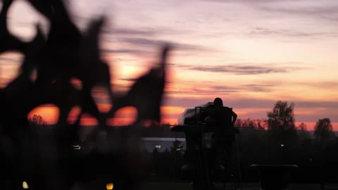 A man sets up a laser in the cemetery. Stock Footage 172427161