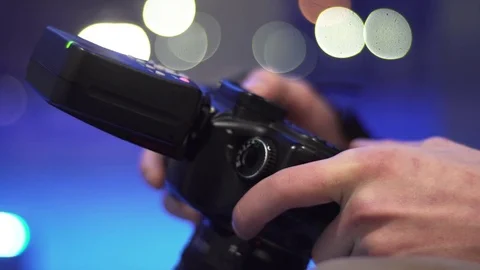 Man sets up a professional camera Stock Footage 72233553