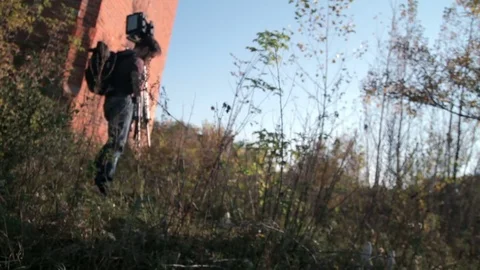 Man sets retro camera in the forest Stock Footage 71825031