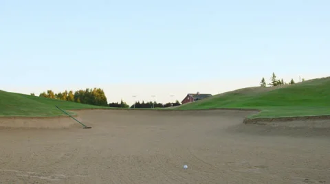 Man sets up for sandbox shot Stock Footage 60192757