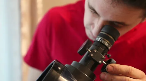 Man sets up a telescope, close-up Stock Footage 60423574