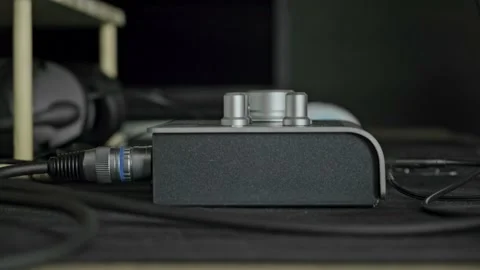 Man setting up an audio interface in the studio Stock Footage 165003281