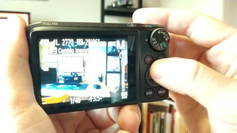 Man setting camera for film. set camera technology on a blur intern. Video stock 233887784