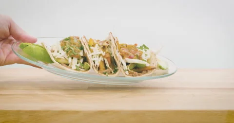 Man Setting Down a Plate of Tacos Stock Footage 141023561
