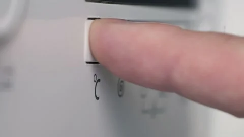 Man Setting the Function Buttons from the Washing Machine Front Panel, 스톡 동영상 181860893
