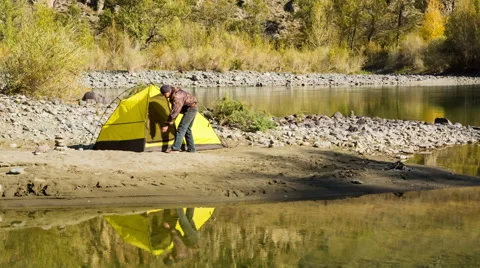 Man setting up his tent for camping Stock Footage 48894364