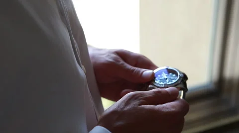 Man setting a nice wrist watch Stock Footage 40704216