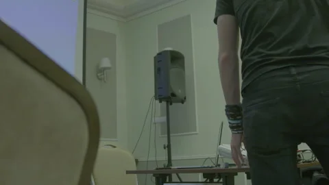 Man Setting Up Presentation Equipment in Room Stock Footage 341863424