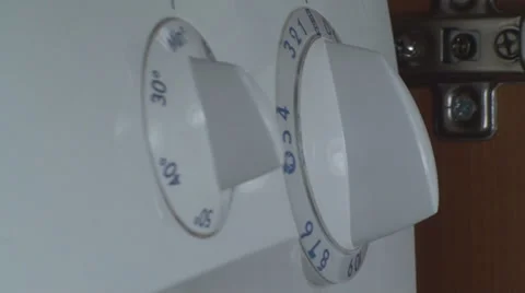 Man Setting Program On A Washing Machine Side Shot Stock-Footage 36293812