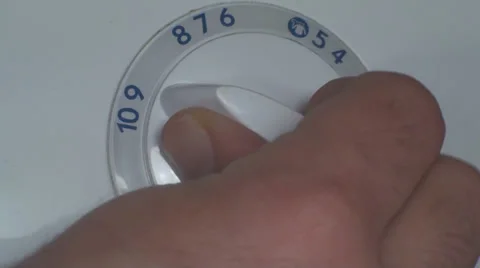 Man Setting Program On A Washing Machine Close Up Video stock 36293887