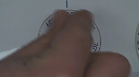 Man Setting Temperature On A Washing Machine Close Up Video stock 36293910