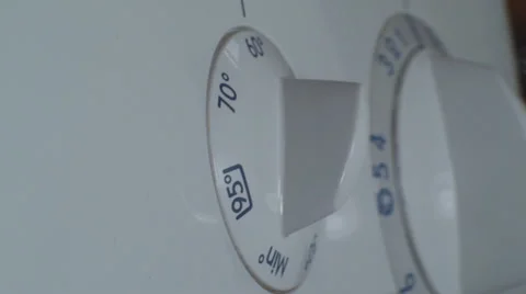 Man Setting Temperature On A Washing Machine Side Shot Video stock 36293934